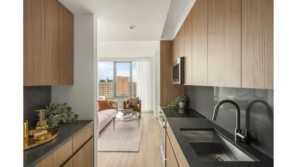 a view of a hallway with painting on the wall