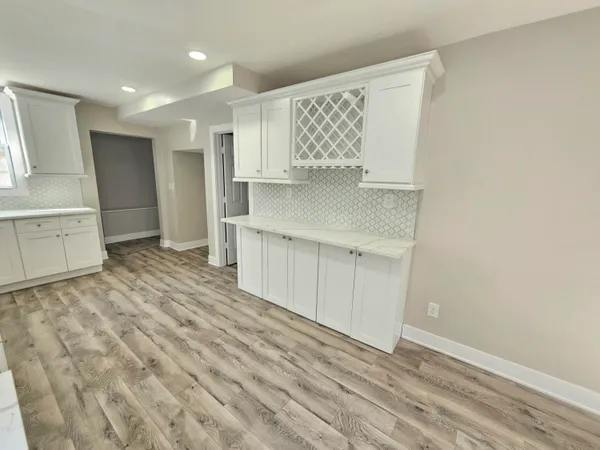 a view of kitchen with wooden floor