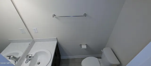 a bathroom with a sink and toilet