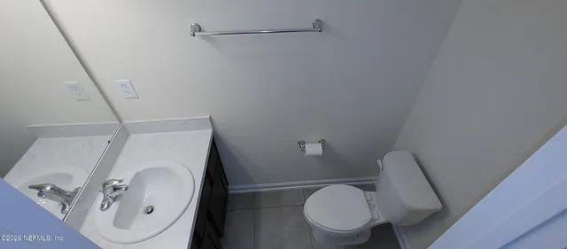 a bathroom with a toilet and a sink