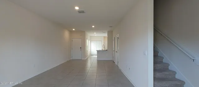 a view of a hallway with a white walls