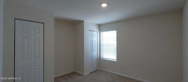 a view of an empty room and window