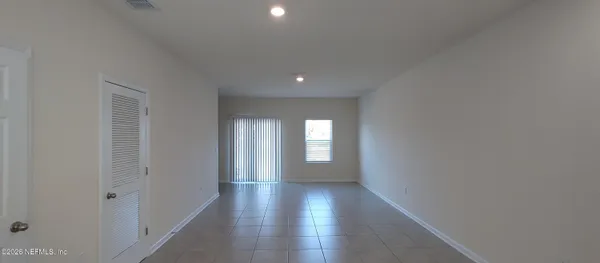 a view of gallery with wooden floor