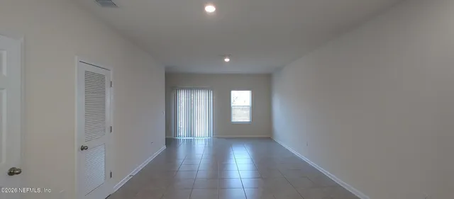 a view of gallery with wooden floor
