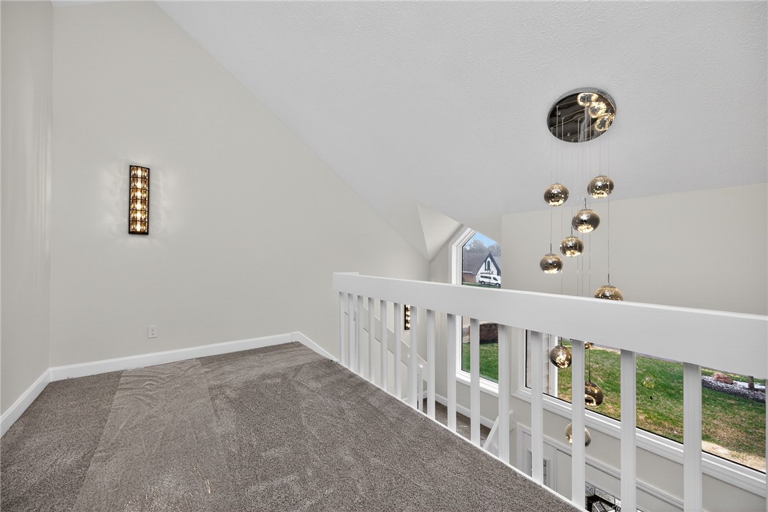 811 Wind Bluff Point Springboro, OH 45066 - Photo 24 of 51 This bright loft space offers an elevated perspective with natural light and a unique chandelier.