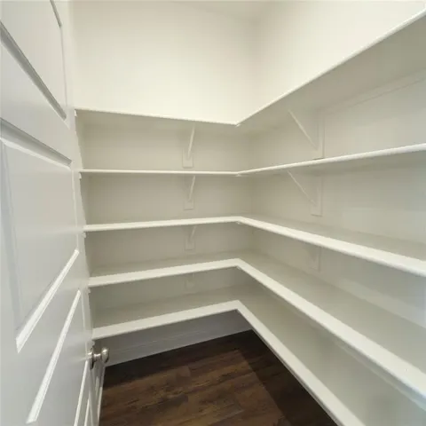 a storage room with wooden floor