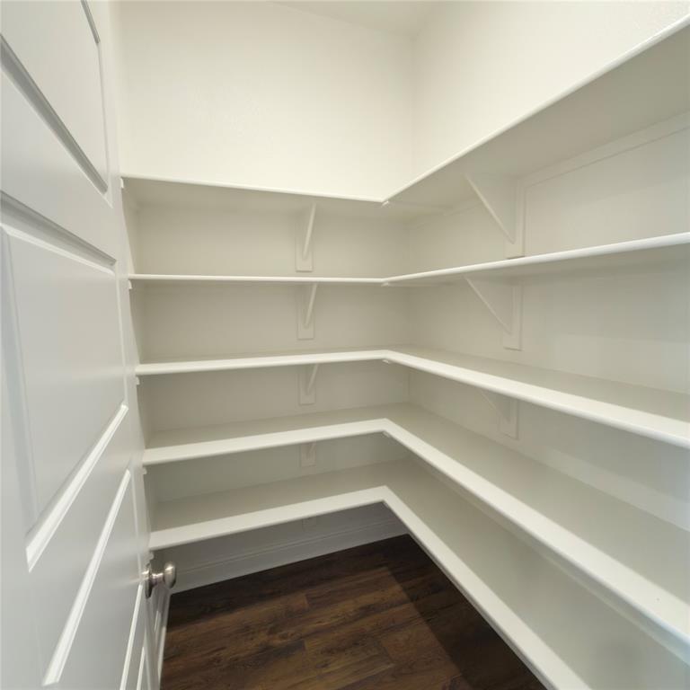 2541 Brunswick Way Allen, TX 75013 - Photo 5 of 20 a storage room with wooden floor