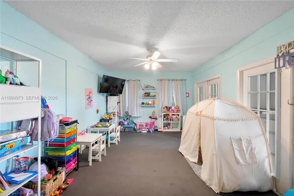 a bed room with a bed and a desk