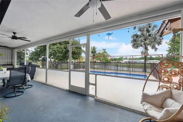 a view of a living room and floor to ceiling window