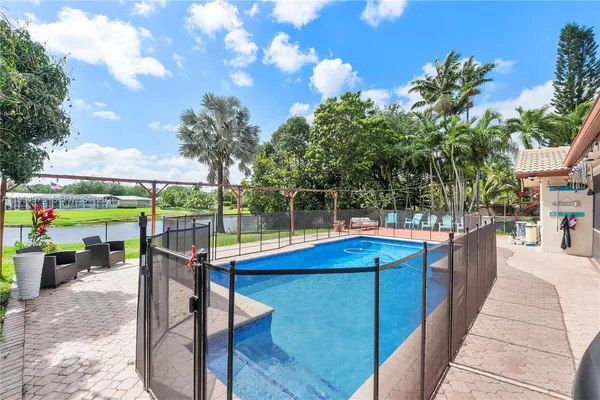 a view of a patio with swimming pool