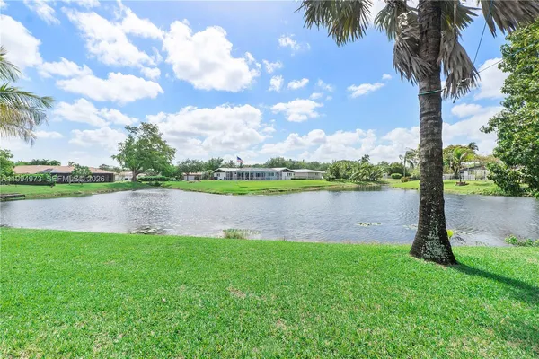 a view of a lake with a big yard