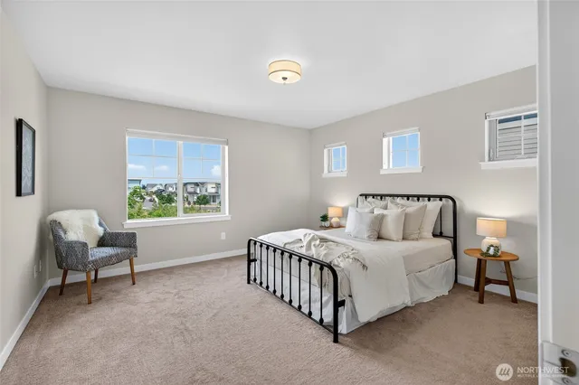 a bedroom with a bed and a chair