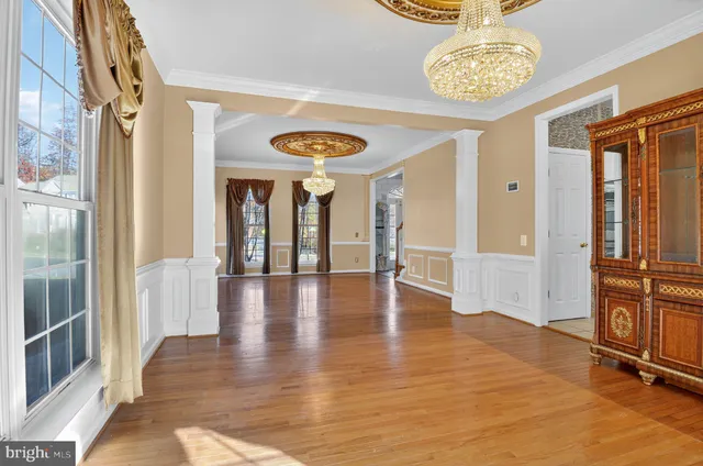 a view of an entryway with wooden floor