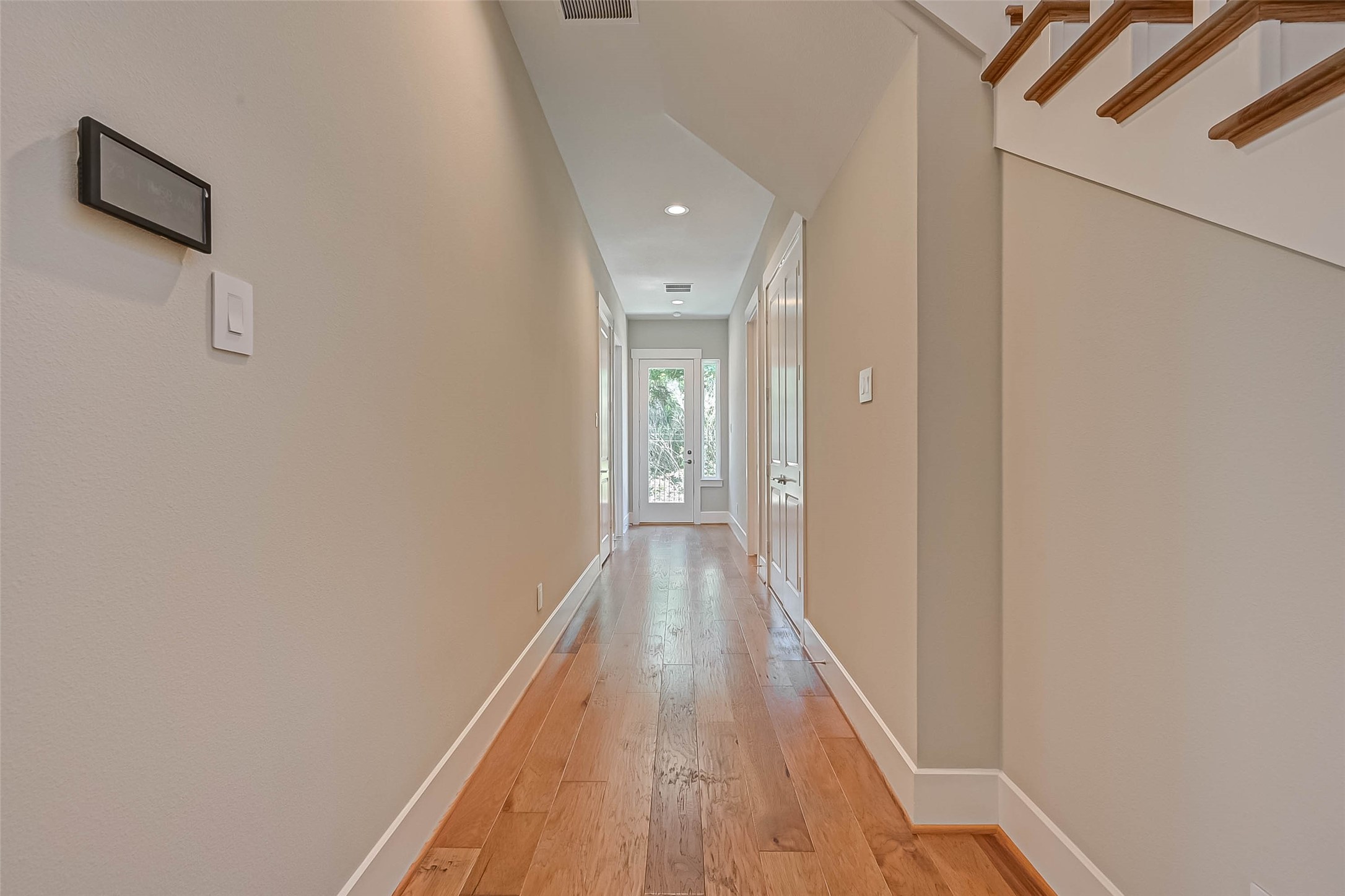 67 Thorpe Lane Spring, TX 77389 - Photo 8 of 27 a view of a hallway with wooden floor