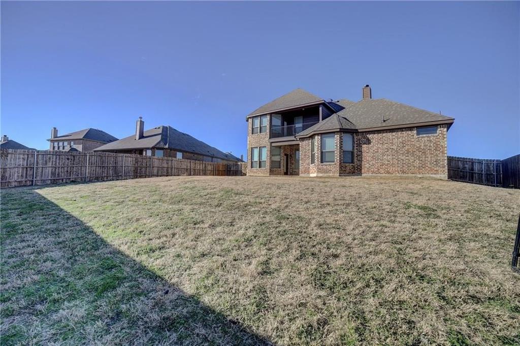 3206 Meadow Ridge Drive Midlothian, TX 76065 - Photo 7 of 37 a front view of a house with a yard
