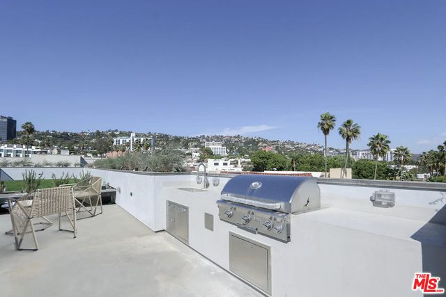 a view of roof deck with seating space