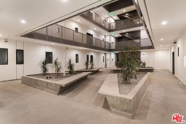 a view of living room with furniture and a chandelier