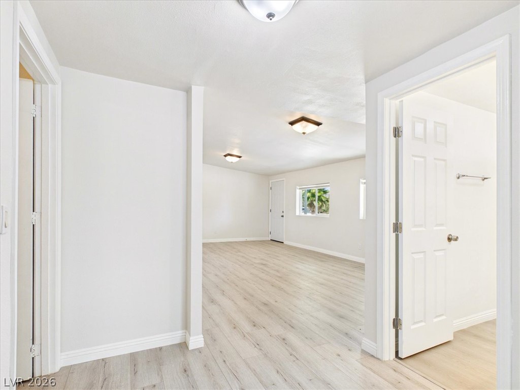 4081 Retread Road Pahrump, NV 89048 - Photo 37 of 98 A naturally illuminated living space offers light-toned laminate flooring and clean white walls, ready for your personal touch.