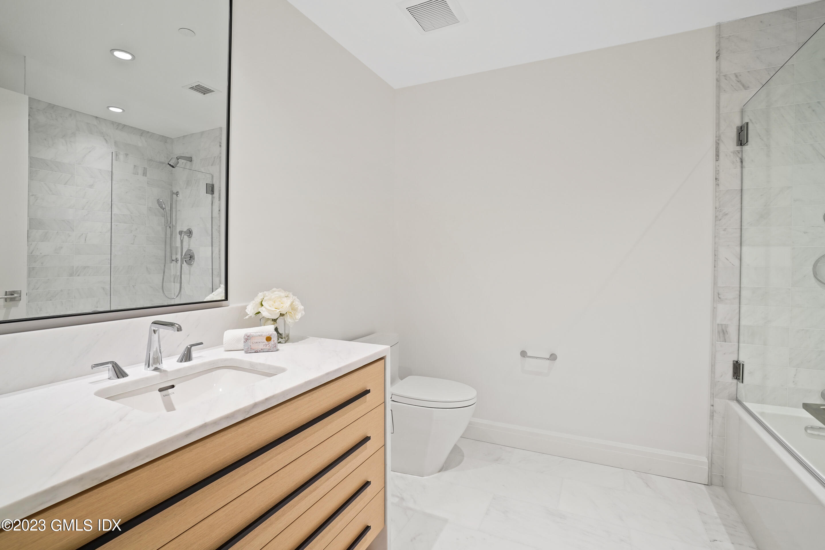 89 River Road, Unit 304 Cos Cob, CT 06807 - Photo 6 of 20 a bathroom with a sink toilet and shower