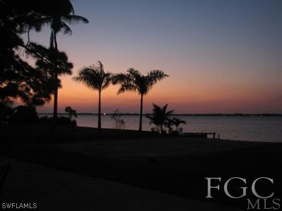 142 Riverview Road Fort Myers, FL 33905 - Photo 5 of 13 a view of an ocean from a yard