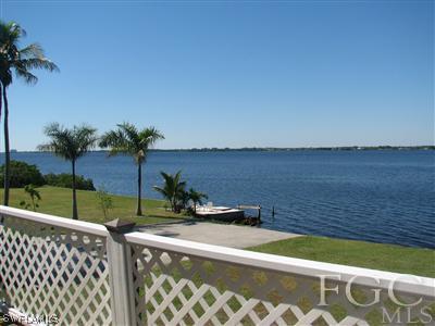 142 Riverview Road Fort Myers, FL 33905 - Photo 9 of 13 a view of a yard with wooden fence