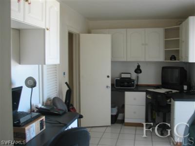 142 Riverview Road Fort Myers, FL 33905 - Photo 10 of 13 a kitchen with a sink and a stove top oven