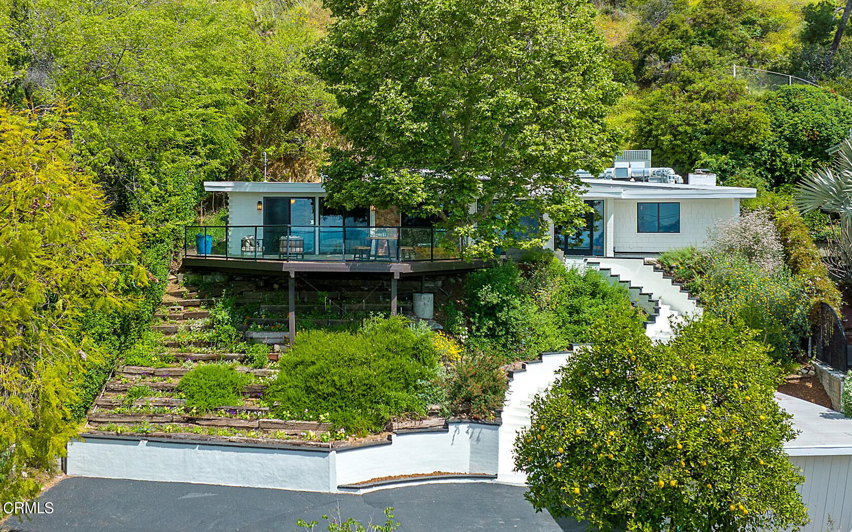 front view of a house with a garden