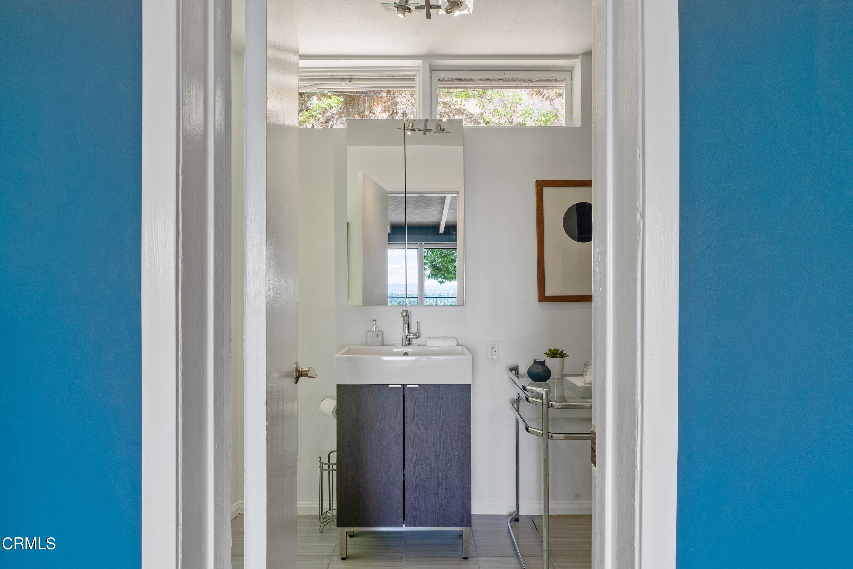 917 Crescent Drive Monrovia, CA 91016 - Photo 14 of 28 a bathroom with a bathroom sink and a mirror