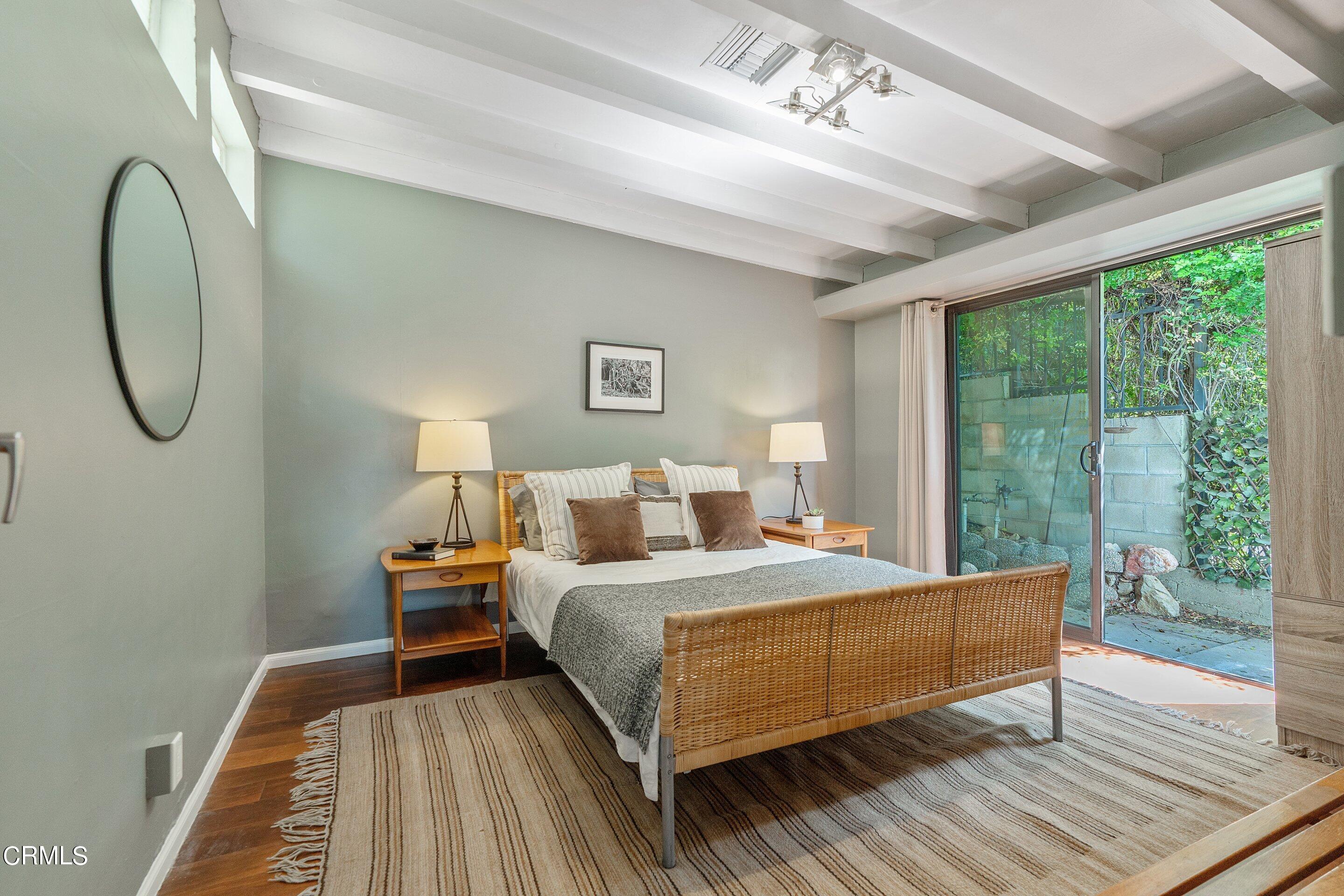 917 Crescent Drive Monrovia, CA 91016 - Photo 17 of 28 a bedroom with a bed a mirror and window