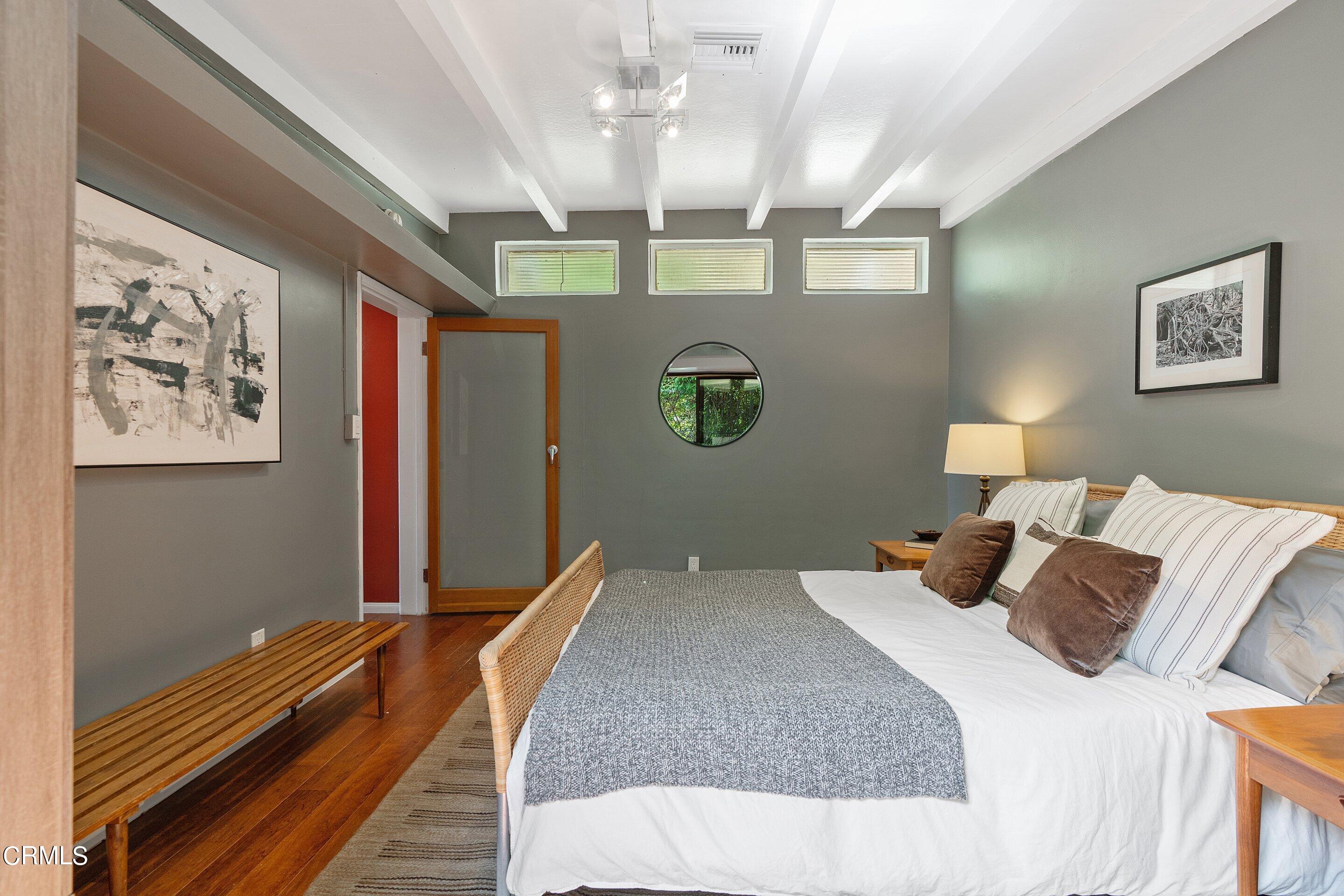 917 Crescent Drive Monrovia, CA 91016 - Photo 18 of 28 a bedroom with a large bed and a chandelier