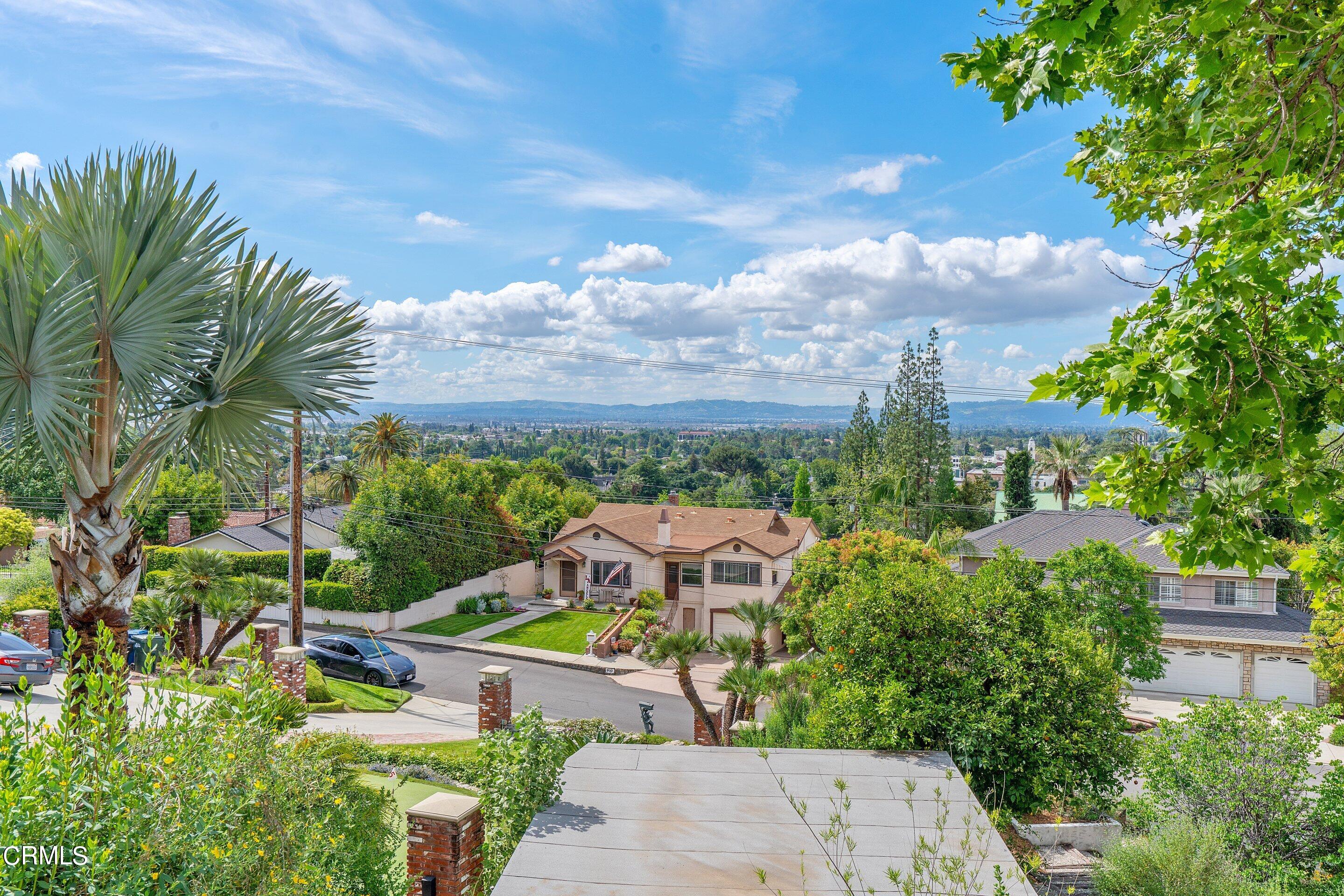 917 Crescent Drive Monrovia, CA 91016 - Photo 24 of 28 a view of a garden with a building in the background