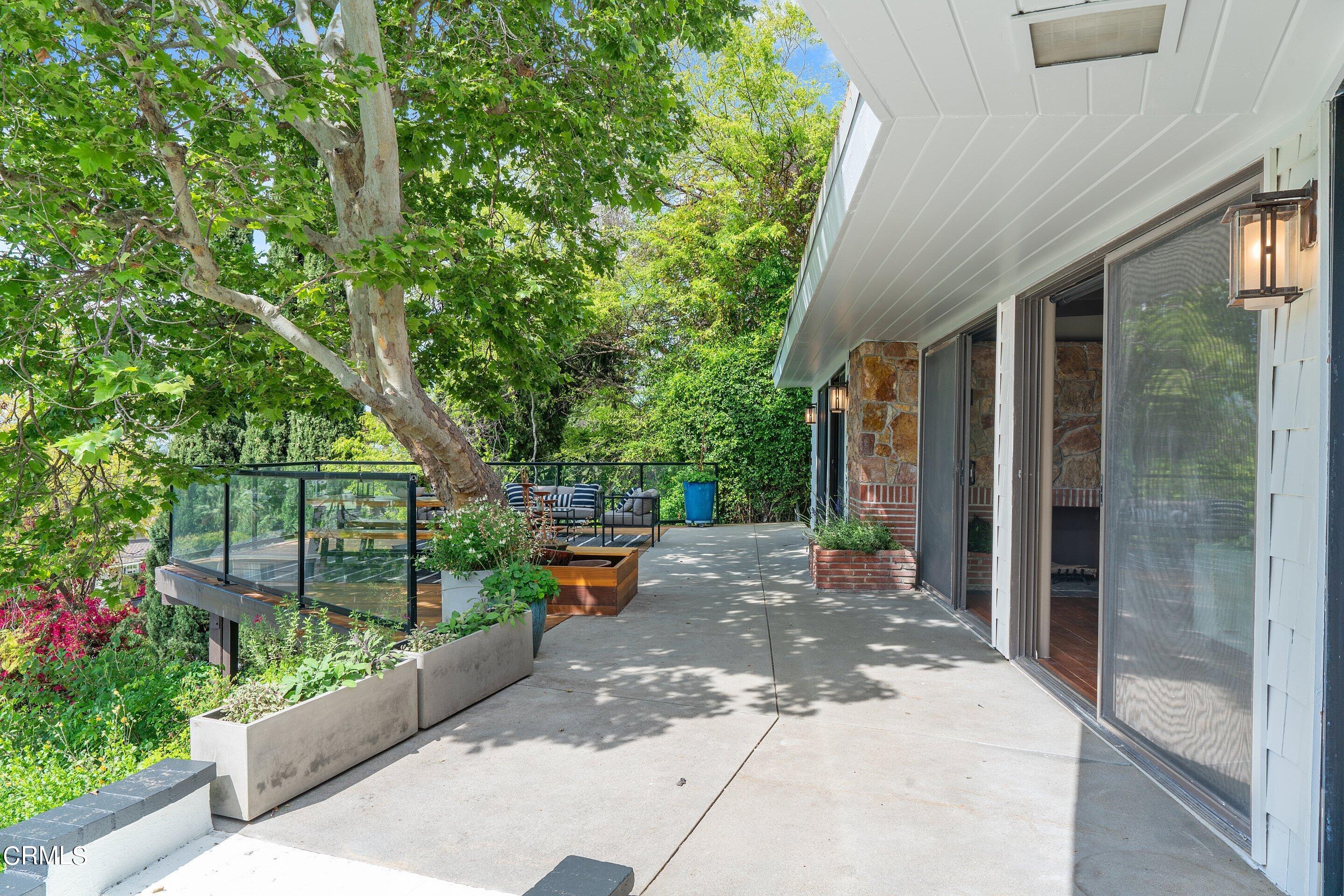 917 Crescent Drive Monrovia, CA 91016 - Photo 4 of 28 a view of a patio with table and chairs and potted plants