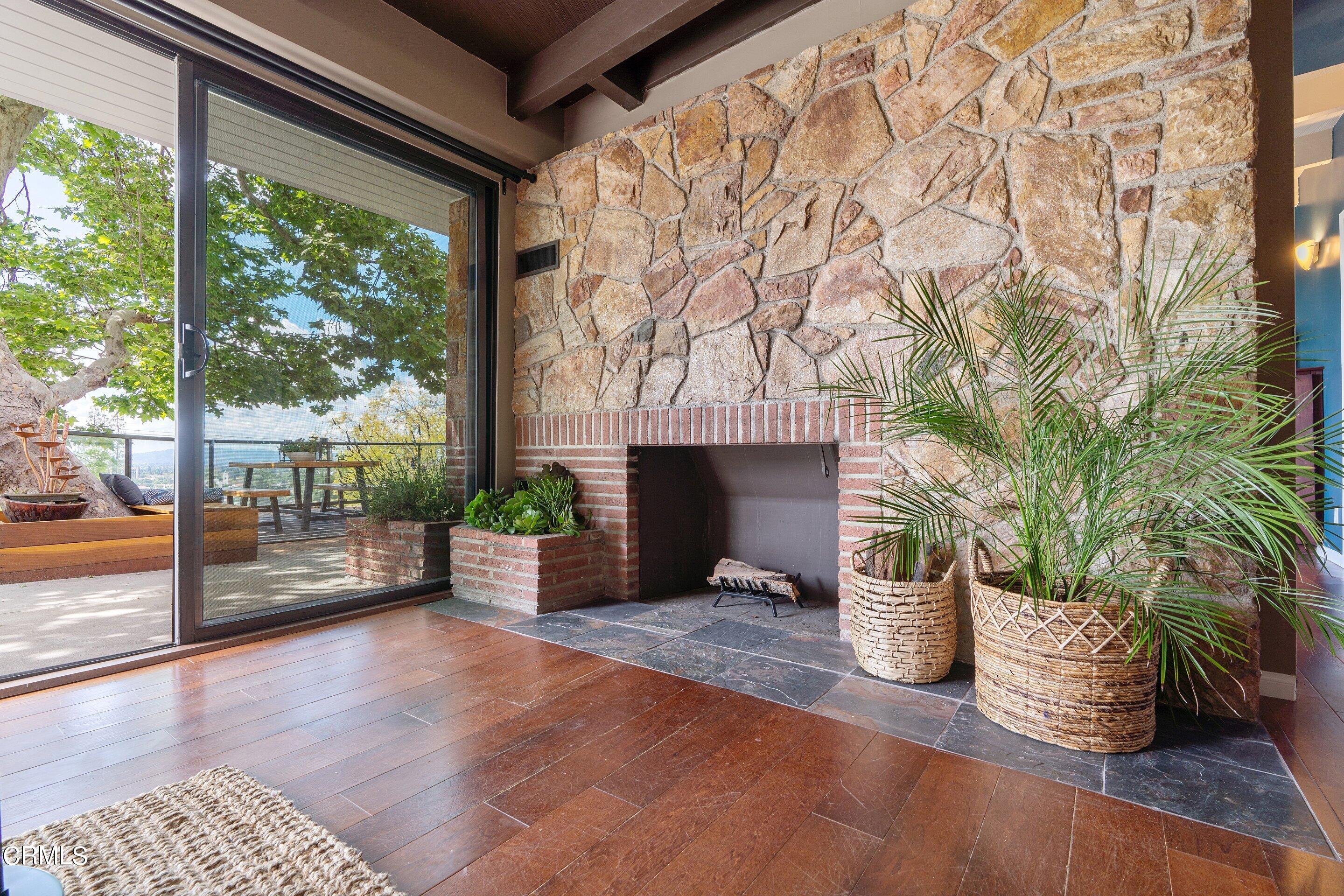 917 Crescent Drive Monrovia, CA 91016 - Photo 8 of 28 a view of empty room with wooden floor and fence