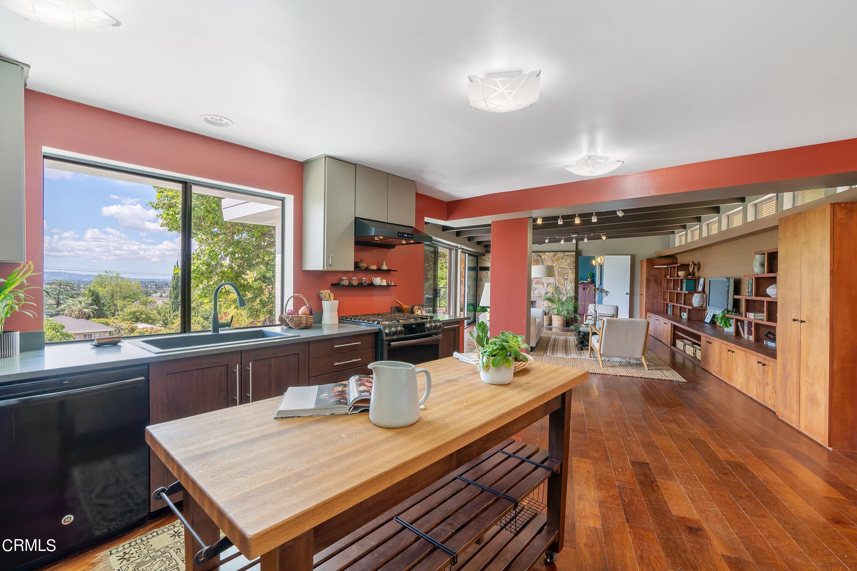 917 Crescent Drive Monrovia, CA 91016 - Photo 9 of 28 a view of a dining room with furniture large window and wooden floor