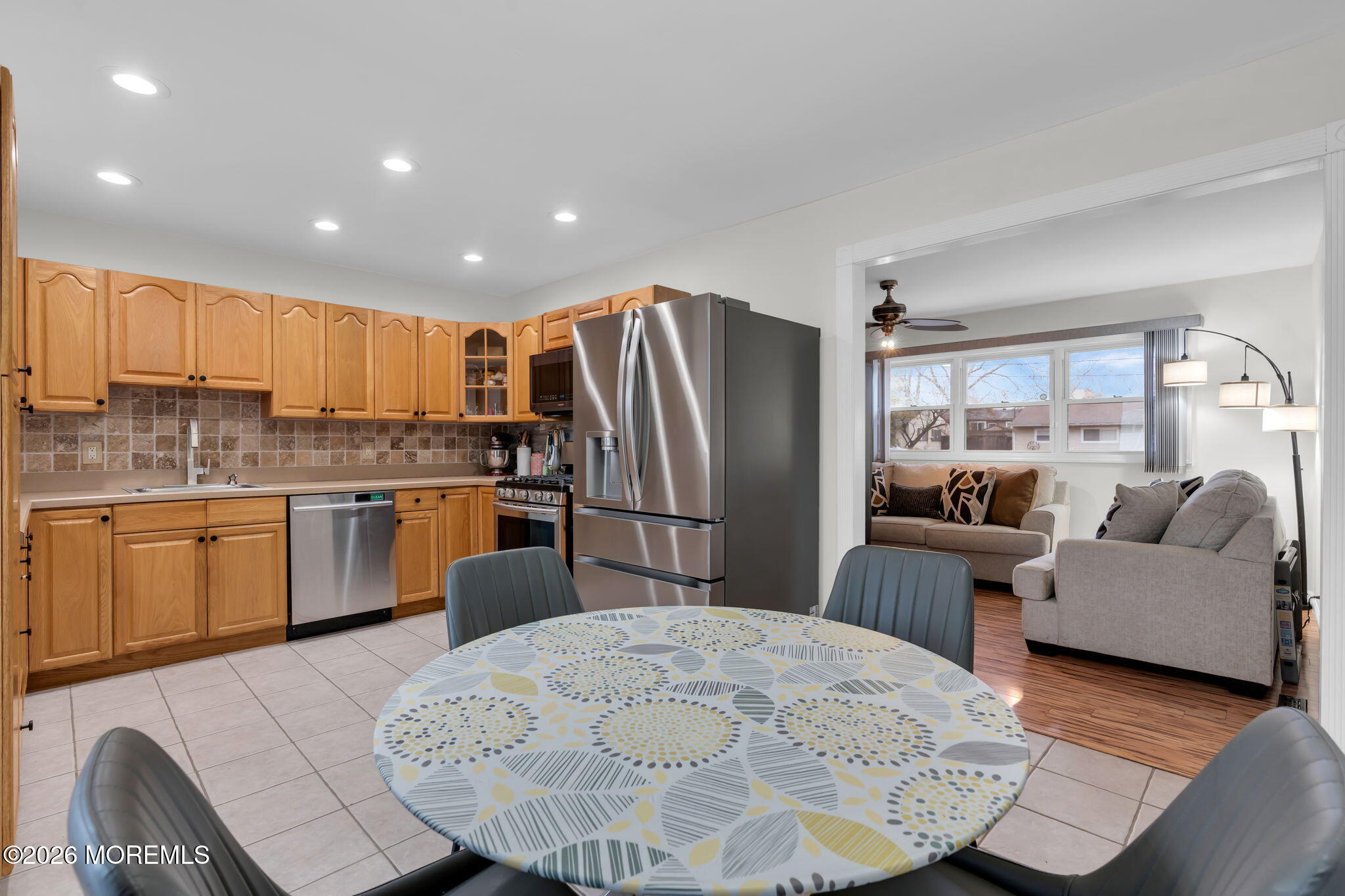 31 Colgate Drive Toms River, NJ 08757 - Photo 13 of 34 a kitchen with granite countertop a refrigerator a sink dishwasher a stove with wooden cabinets and floor