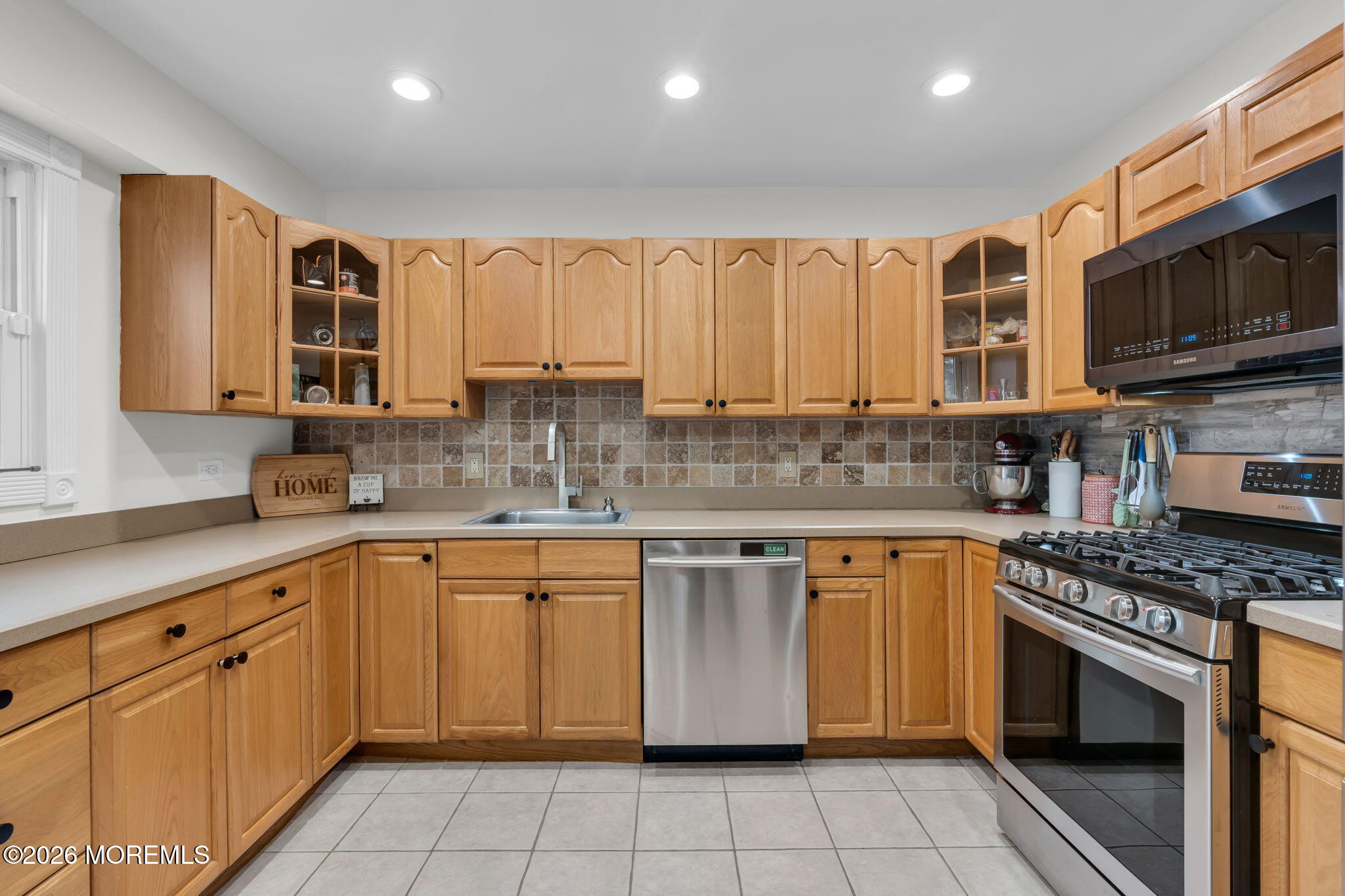 31 Colgate Drive Toms River, NJ 08757 - Photo 17 of 34 a kitchen with stainless steel appliances granite countertop a stove sink microwave and cabinets