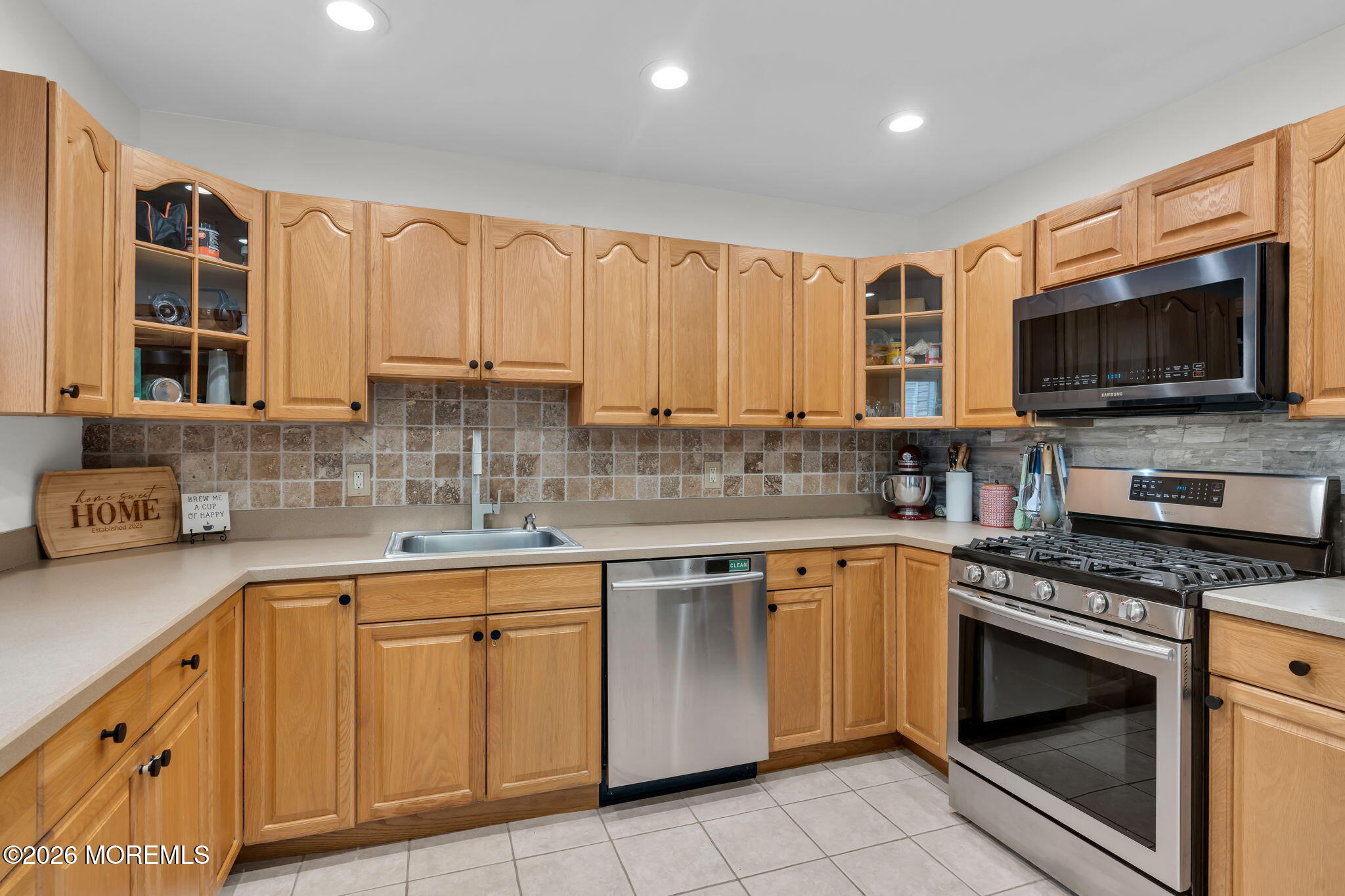 31 Colgate Drive Toms River, NJ 08757 - Photo 19 of 34 a kitchen with stainless steel appliances granite countertop a stove sink microwave and cabinets