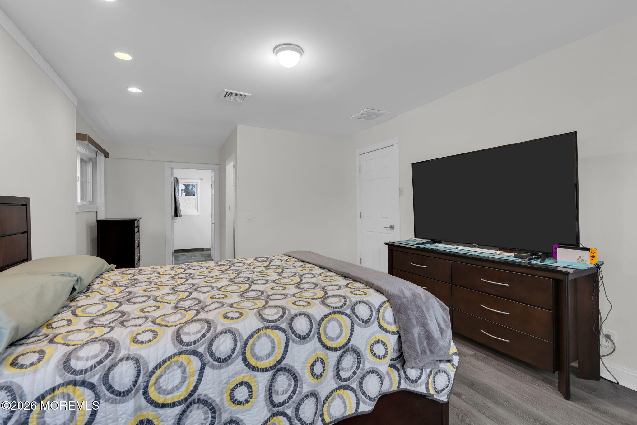 31 Colgate Drive Toms River, NJ 08757 - Photo 22 of 34 a bedroom with a bed and a flat screen tv