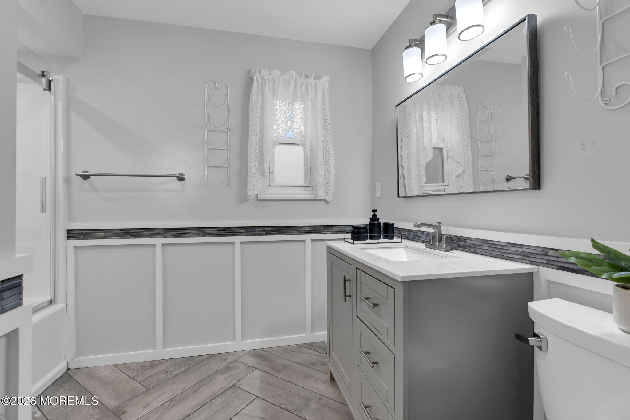 31 Colgate Drive Toms River, NJ 08757 - Photo 28 of 34 a bathroom with a sink vanity and mirror