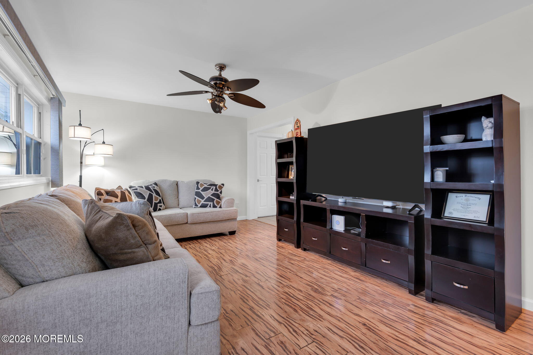 31 Colgate Drive Toms River, NJ 08757 - Photo 8 of 34 a living room with furniture and a flat screen tv