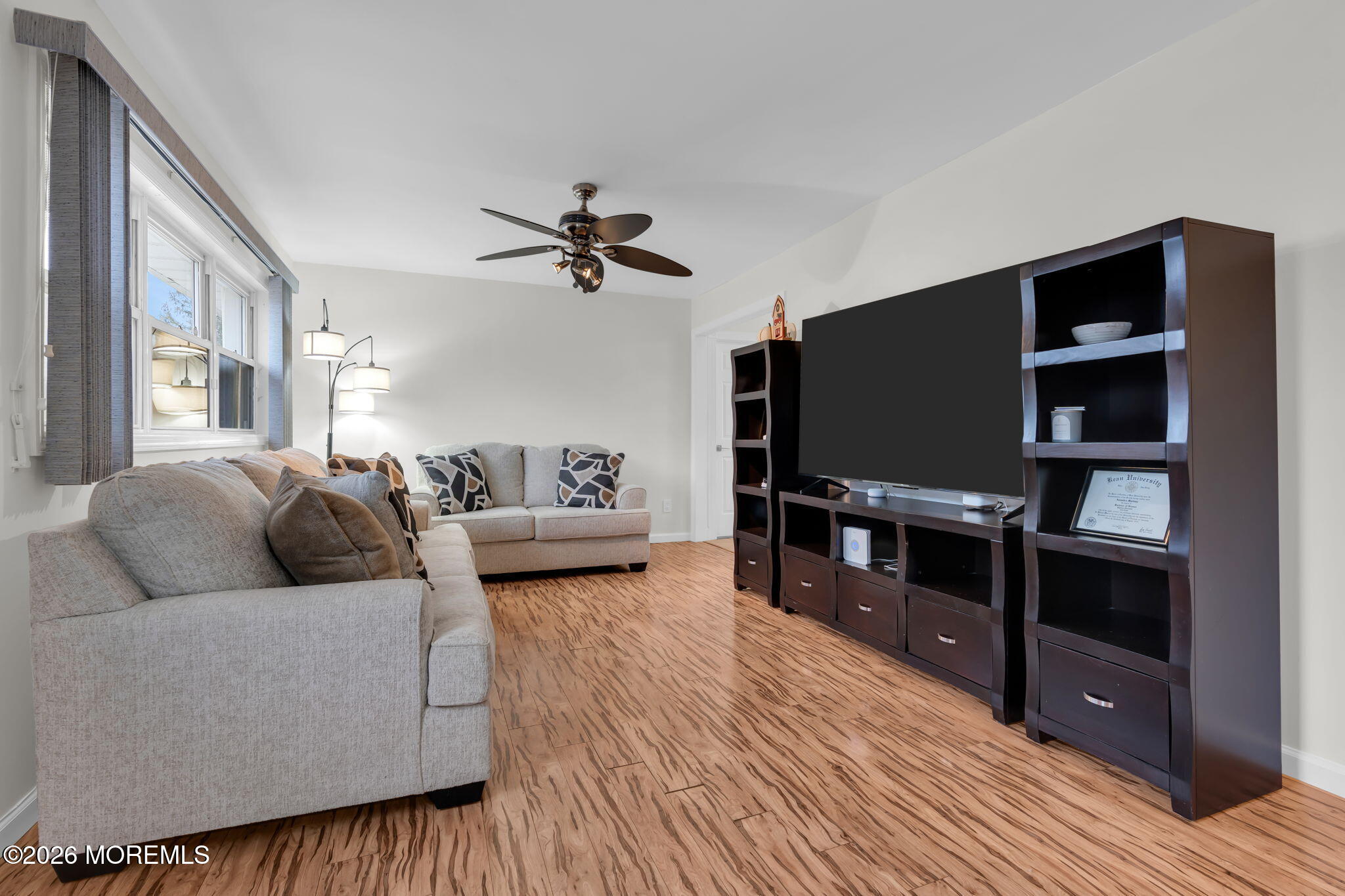 31 Colgate Drive Toms River, NJ 08757 - Photo 9 of 34 a living room with furniture and a flat screen tv