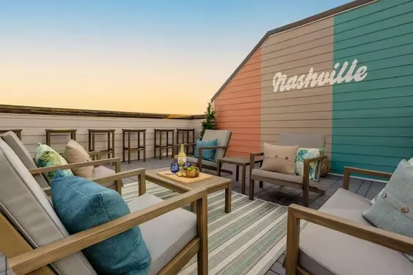 swimming pool view with a seating space