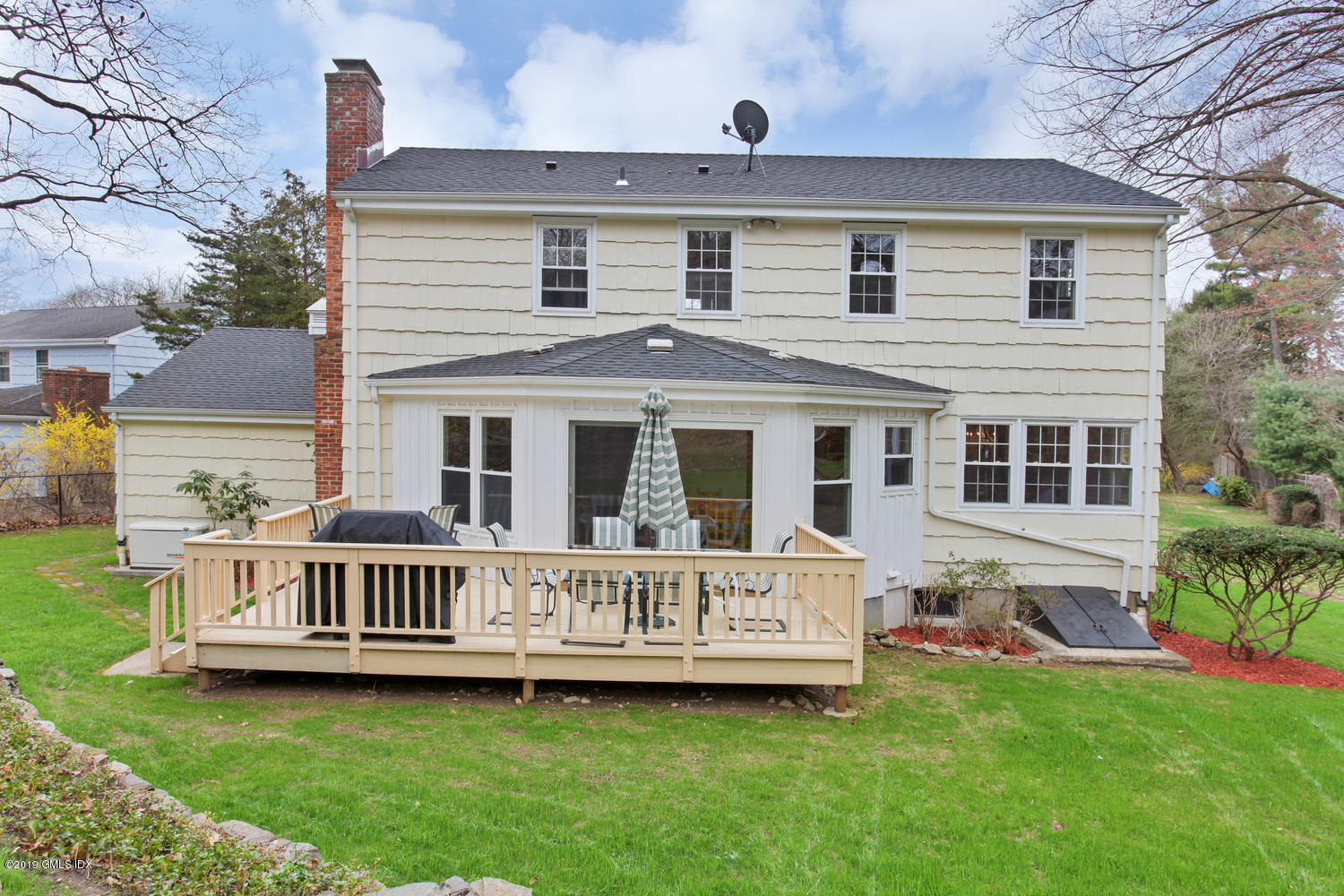28 Revere Road Riverside, CT 06878 - Photo 22 of 29 a view of a house with a yard and deck