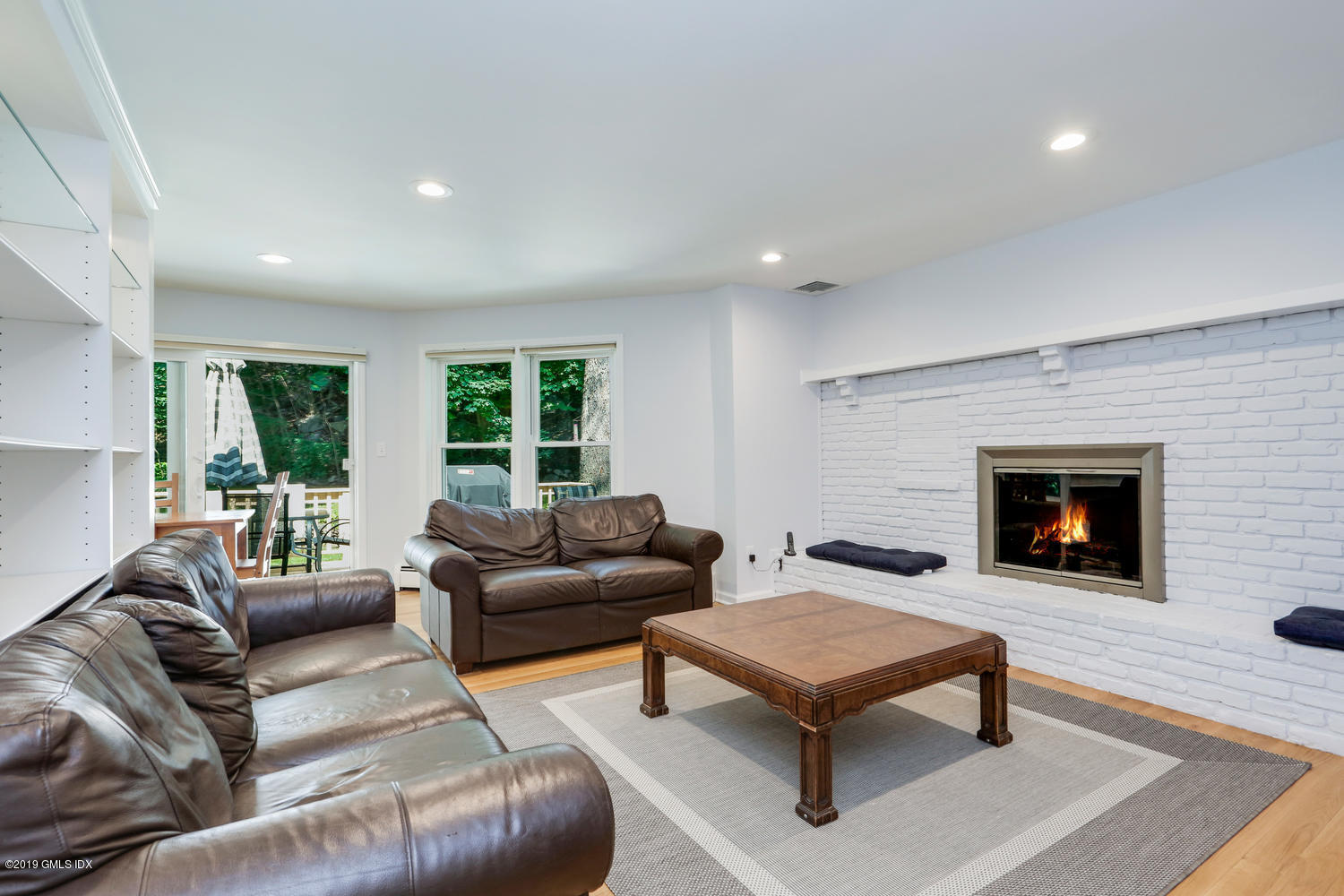 28 Revere Road Riverside, CT 06878 - Photo 8 of 29 a living room with furniture and a fireplace