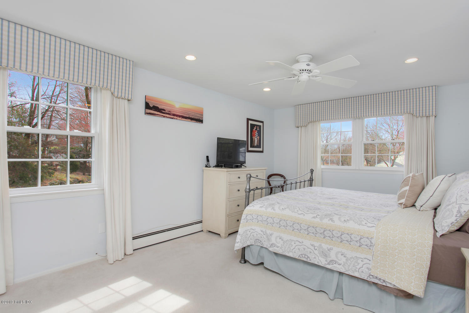 28 Revere Road Riverside, CT 06878 - Photo 10 of 29 a bedroom with a large bed and a window