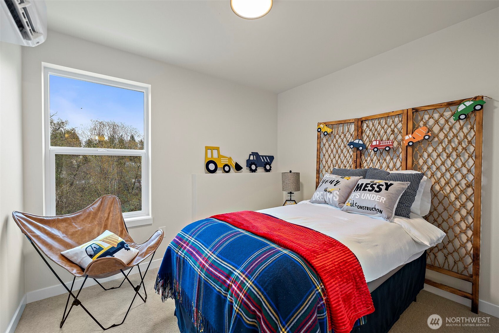 5015 144th Street Southwest, Unit B3 Edmonds, WA 98026 - Photo 33 of 39 a bedroom with a bed and wooden floor