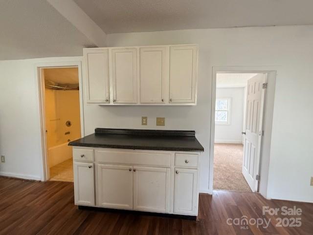 104 Price Street Mount Holly, NC 28120 - Photo 13 of 37 a kitchen with granite countertop a sink cabinets and wooden floor
