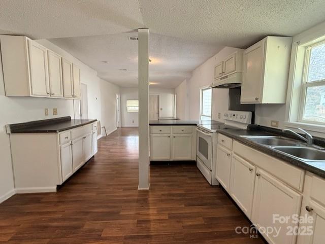 104 Price Street Mount Holly, NC 28120 - Photo 17 of 37 a large kitchen with stainless steel appliances lots of counter space and a sink