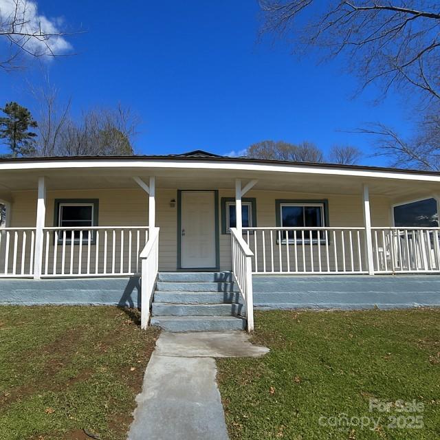 104 Price Street Mount Holly, NC 28120 - Photo 3 of 37 a view of a house with backyard and porch