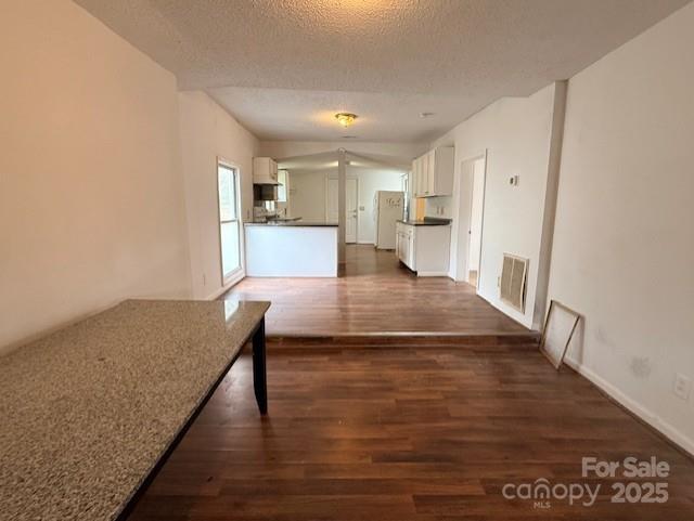 104 Price Street Mount Holly, NC 28120 - Photo 7 of 37 a view of kitchen and hall with wooden floor
